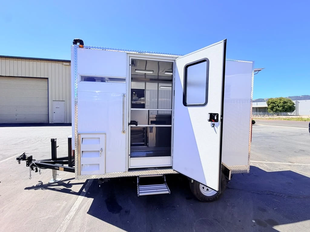 White food trailer with rear doors open